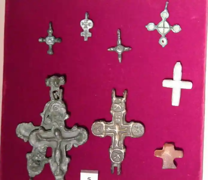 Christian crosses, solar disc, and crucifix
